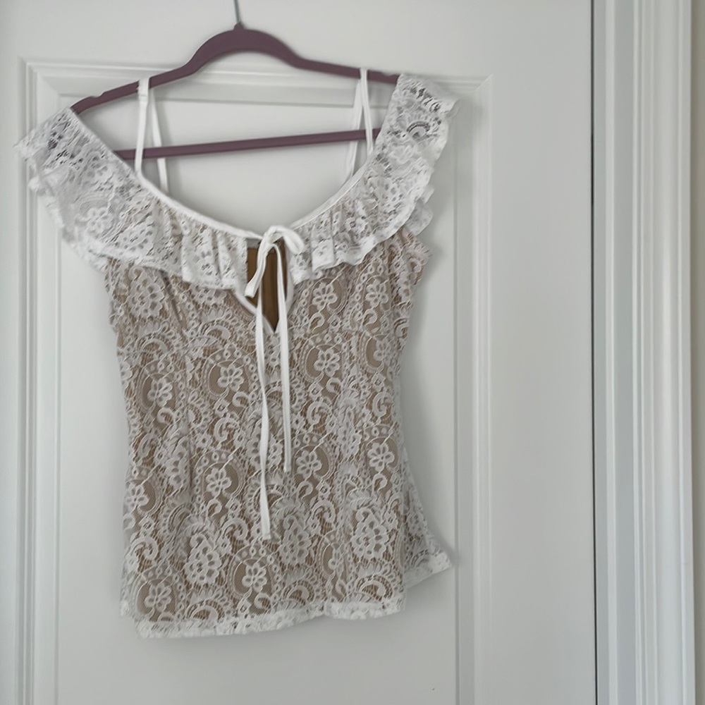 Blouse with tan underneath covering the top with lace